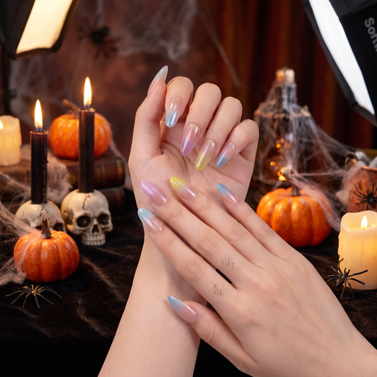 Woman wearing Libra press-on nails with a feminine Halloween-inspired beauty look.