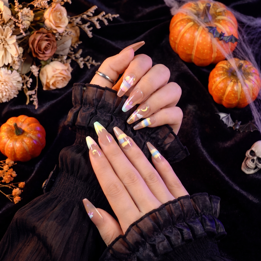 Woman wearing Taurus Zodiac press-on nails with a Halloween-inspired fall look.