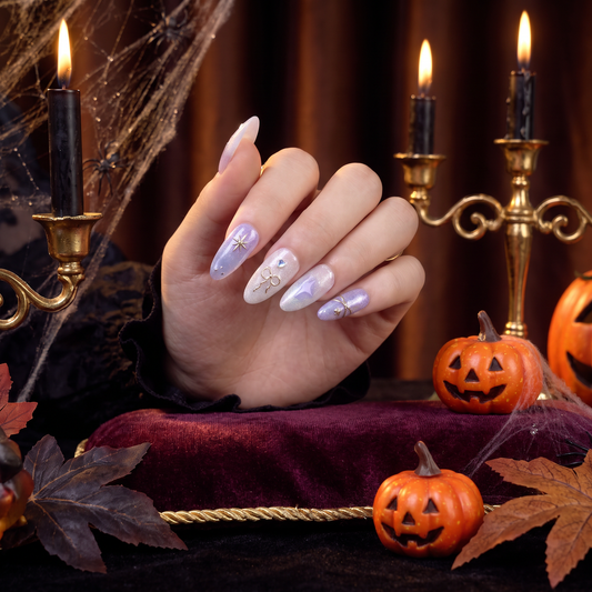 Woman wearing elegant Virgo Zodiac press-on nails with a Halloween-inspired look.