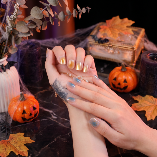 Woman wearing Gemini Zodiac press-on nails with a spooky-season inspired look.