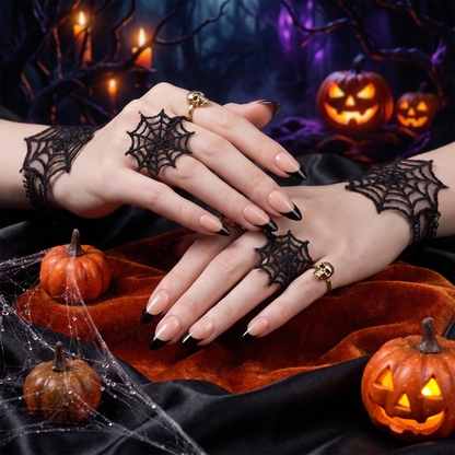 Woman wearing black and nude Sagittarius II press-on nails with a Halloween-inspired look.